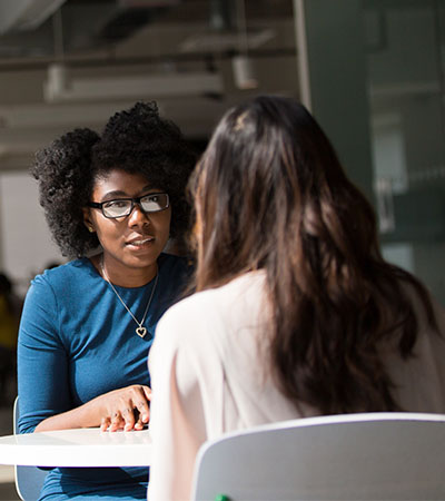 Therapist speaking to a patient.